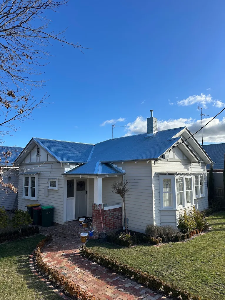 Weatherboard home with a new blue Colorbond metal roof