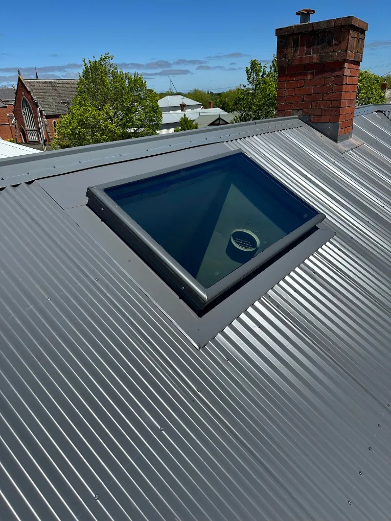 Skylight installed in a new corrugated metal roof