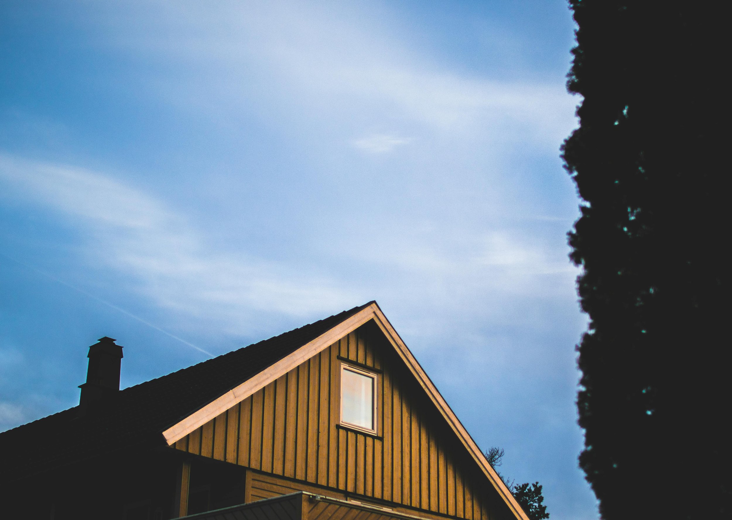 Roofing work at golden hour with dramatic sky